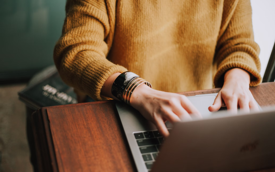 A person works on their laptop